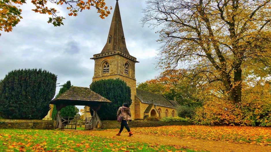 Walking in Churchyard, Lower Slaughter, The Cotswolds